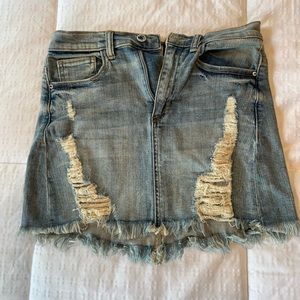 Distressed denim mini skirt
